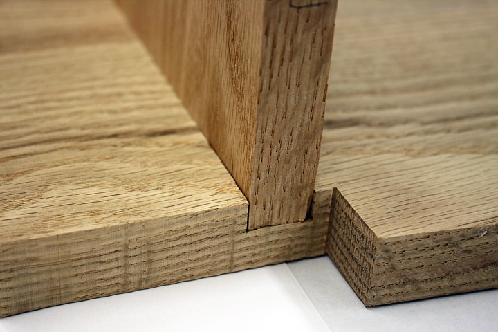 Types of Joints for Cabinets - Close-up of a dado joint in a kitchen cabinet shelf