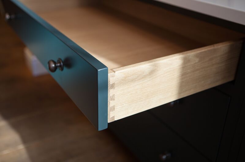 Types of Joints for Cabinets - Dovetail joint construction in a custom kitchen drawer, showcasing strength and beauty