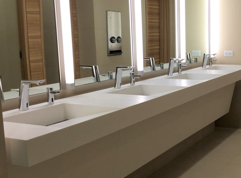 Image of a commercial restroom with ADA-compliant vanities ensuring accessibility for all users