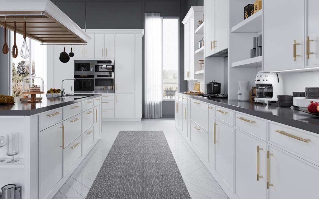 A minimalist kitchen featuring matte white slim shaker cabinets with a push-to-open mechanism