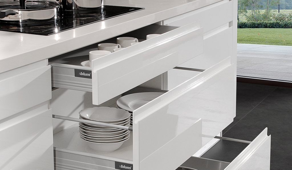 Custom handleless cabinets with pull-out shelves and specialized storage configurations