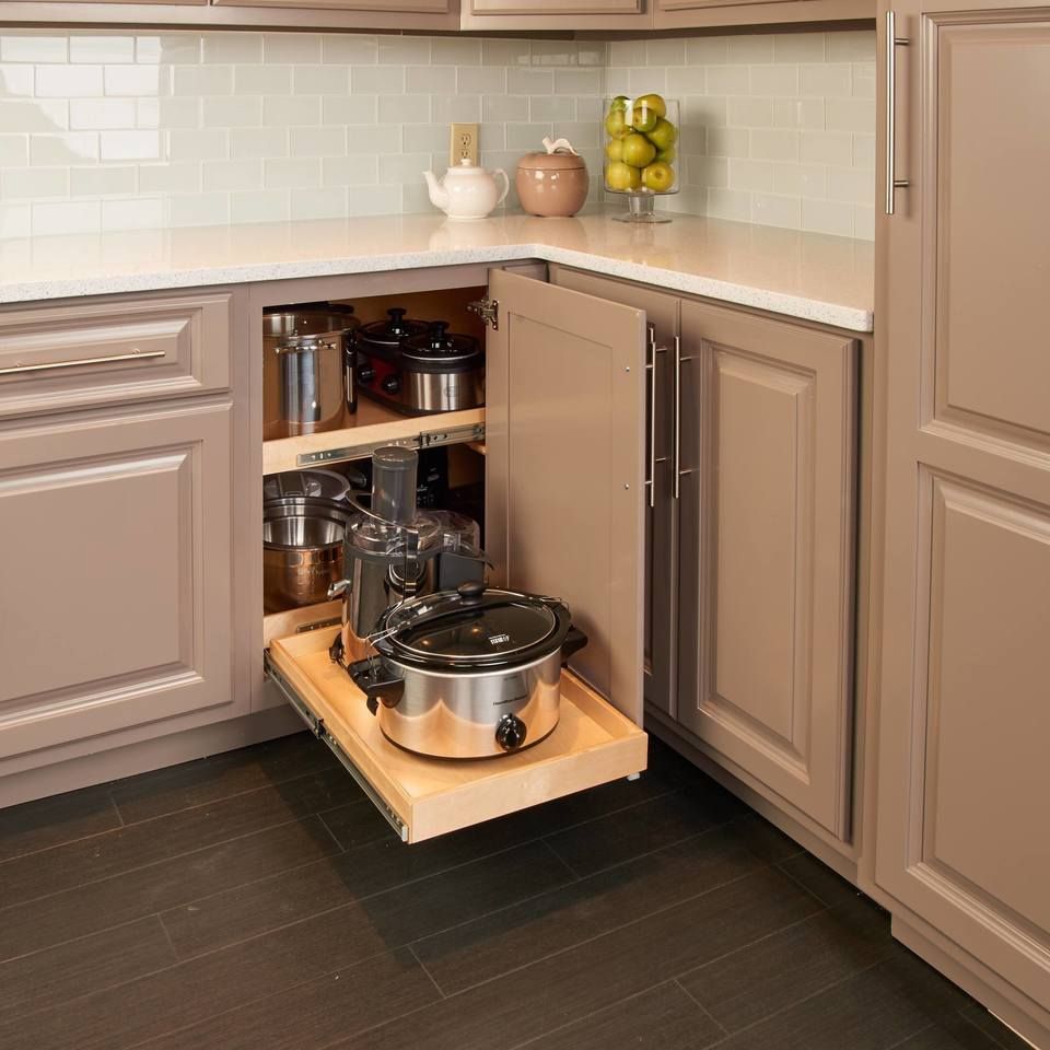 Customized blind corner base cabinet with pull-out shelves for easy access.