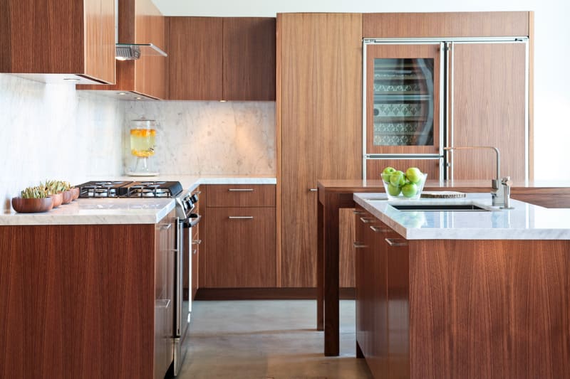 Plywood flat panel cabinet doors add a natural, aesthetic to luxury kitchen designs