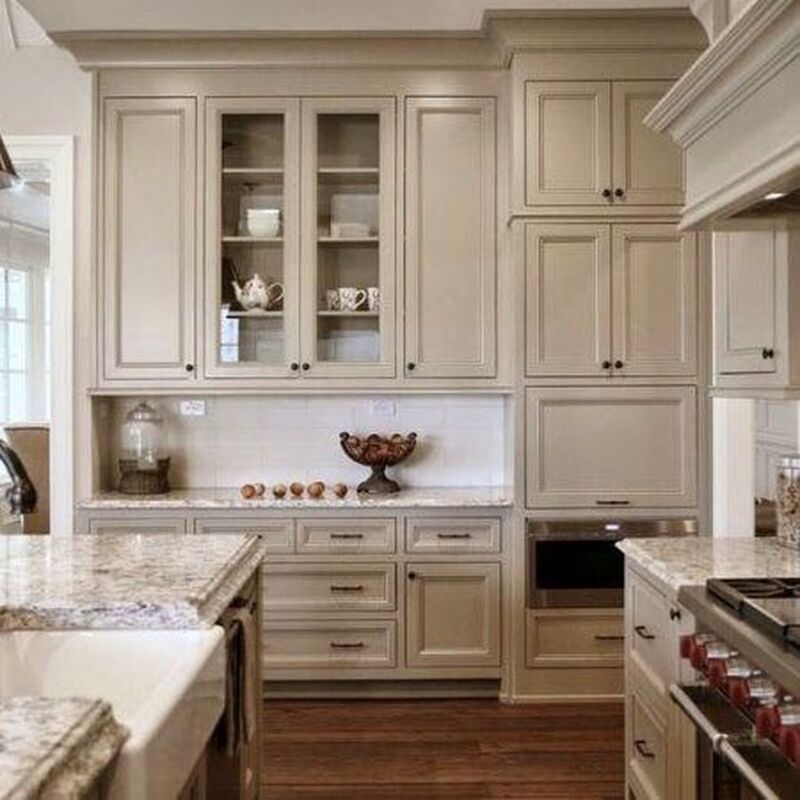 Warm Kitchen Cabinet Colors: Kitchen with taupe cabinets, brass fixtures