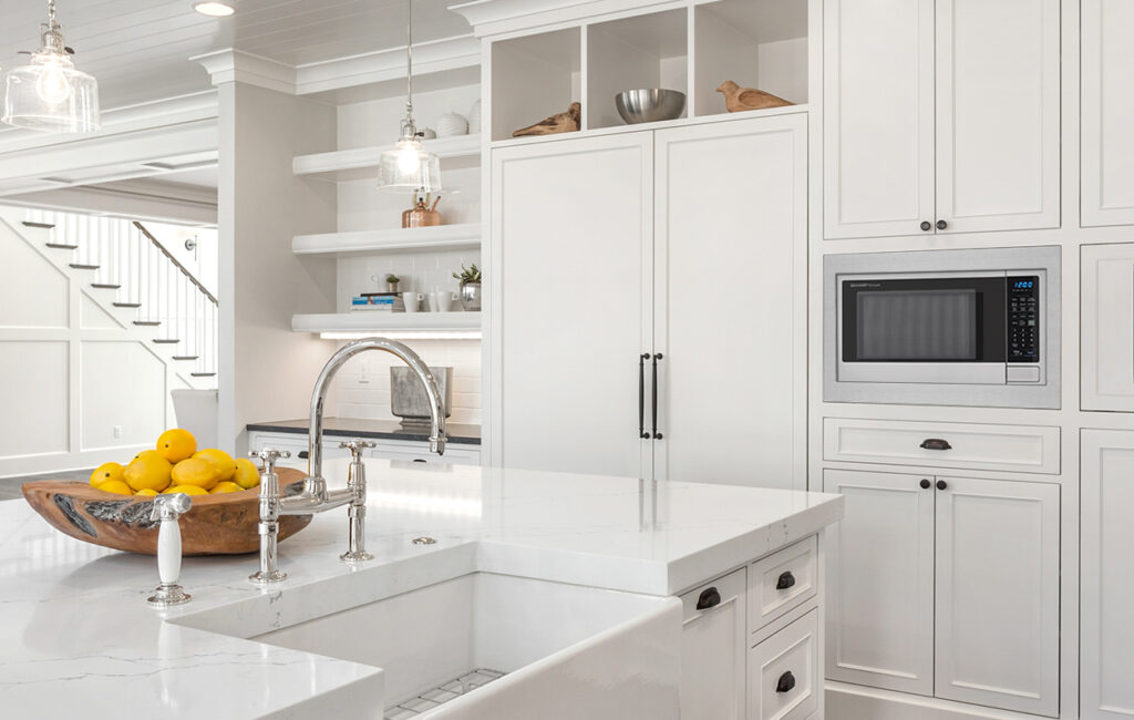 Microwave cabinet with a sleek and modern finish matching kitchen cabinetry