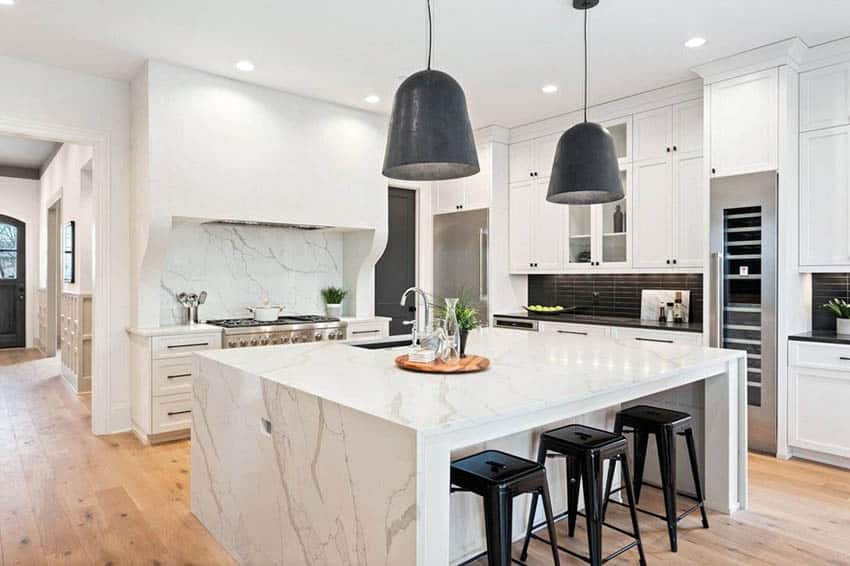 A bright renovated kitchen with modern white painted cabinets