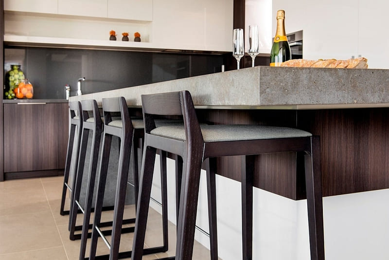 Bar height kitchen island with tall bar stools, perfect for entertaining