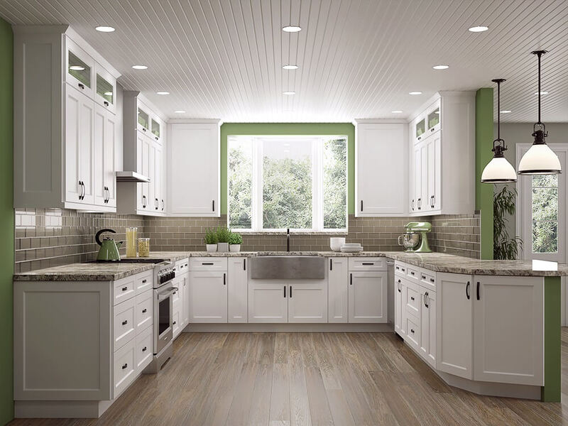 Bright kitchen featuring warm white shaker cabinets, marble countertops, and brushed nickel hardware