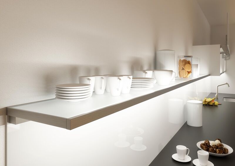 Kitchen with open shelves illuminated by integrated LED lighting