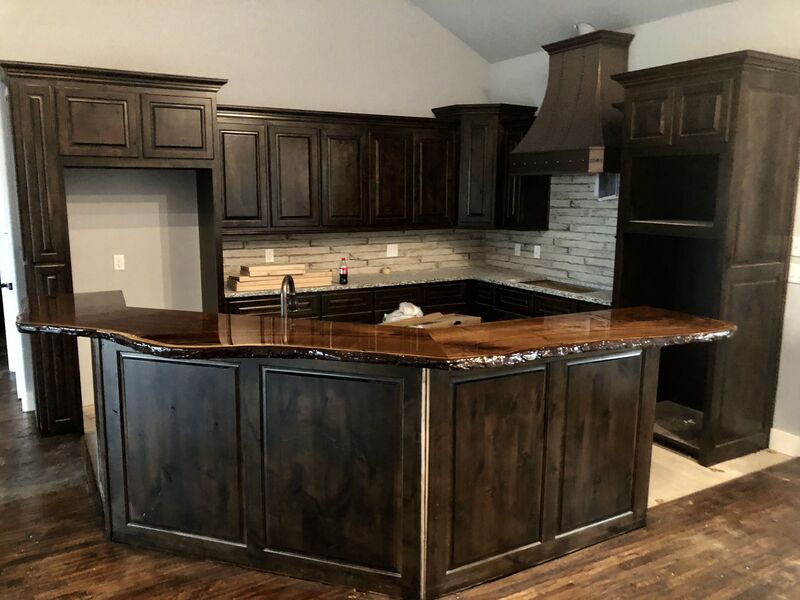 Dark-stained walnut cabinets in a luxury kitchen