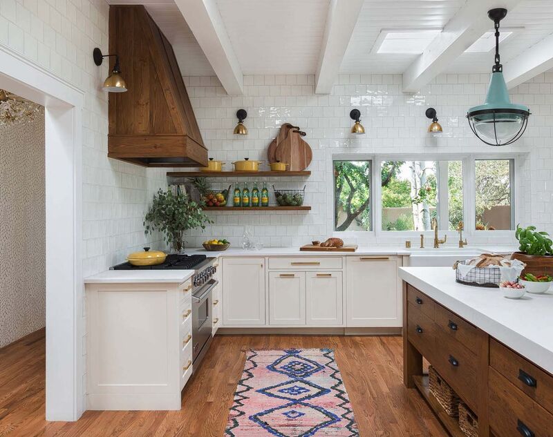 Eclectic kitchen with white painted cabinets