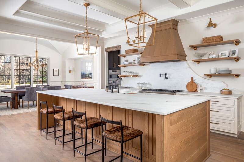 Elegant kitchen featuring warm white cabinets, oak accents for a timeless design