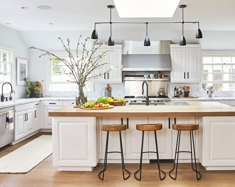 Elegant kitchen with white painted cabinets and wood accents for a timeless appeal