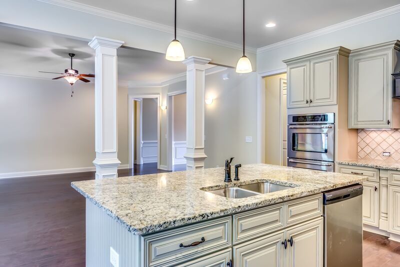 Kitchen island base cabinet with an integrated sink, designed for both functionality and style