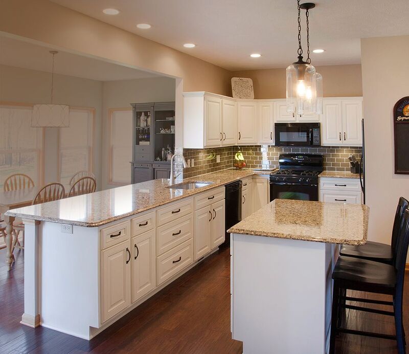 Kitchen showcasing durable warm white cabinets