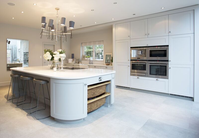 Shaker style kitchen island in a custom home with white cabinetry