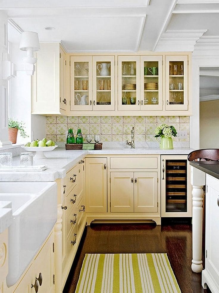 Transitional kitchen with textured cream-painted cabinets