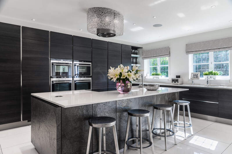 Luxury kitchen with textured black painted cabinets