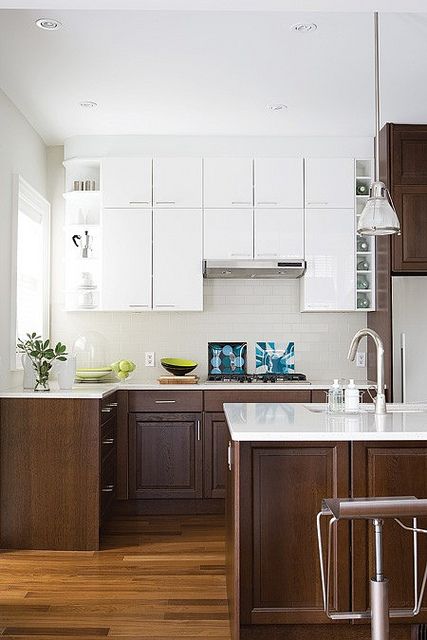 Kitchen with mid-tone brown cabinets on the lowers and white upper cabinets for a classic look