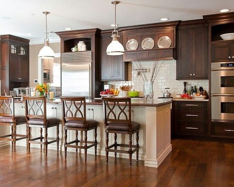 Kitchen with sustainable dark brown painted cabinets and reclaimed wood accents