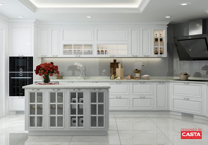 A sleek modern kitchen featuring custom-sized cabinets with polished stainless steel pulls for an elegant touch