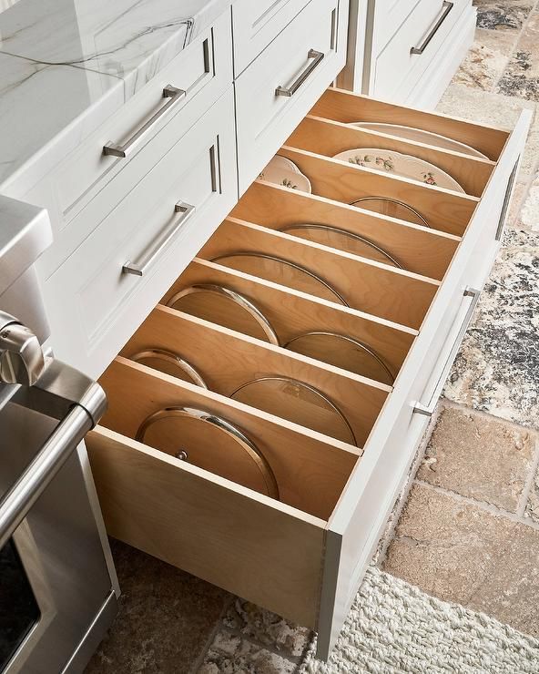 A contemporary kitchen with oversized drawer pulls perfectly sized for deep storage, ensuring easy access