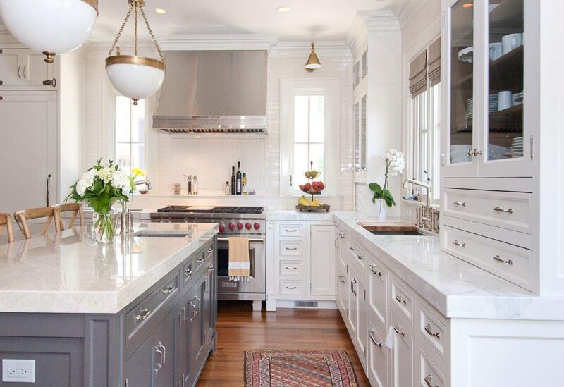 A modern kitchen showcasing polished chrome pulls perfectly sized for large cabinets