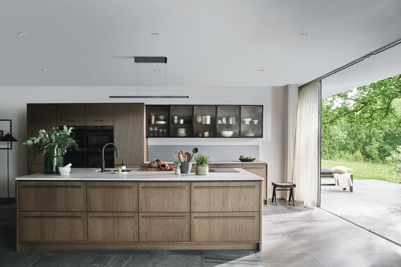 A sustainably manufactured kitchen island featuring responsibly sourced wood and low-emission finishes, designed for eco-conscious clients.