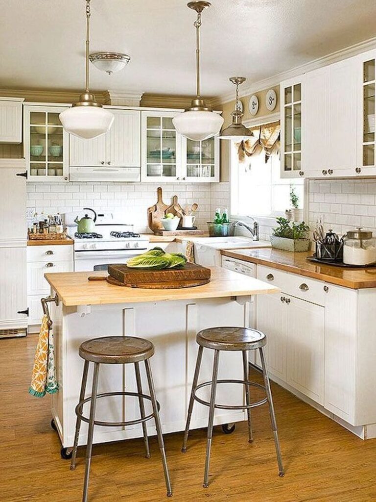 Compact kitchen island in a small apartment, featuring a minimalist design with a light wood finish