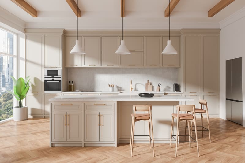 A bespoke custom kitchen island by Casta Cabinetry, showcasing integrated storage and modern lighting