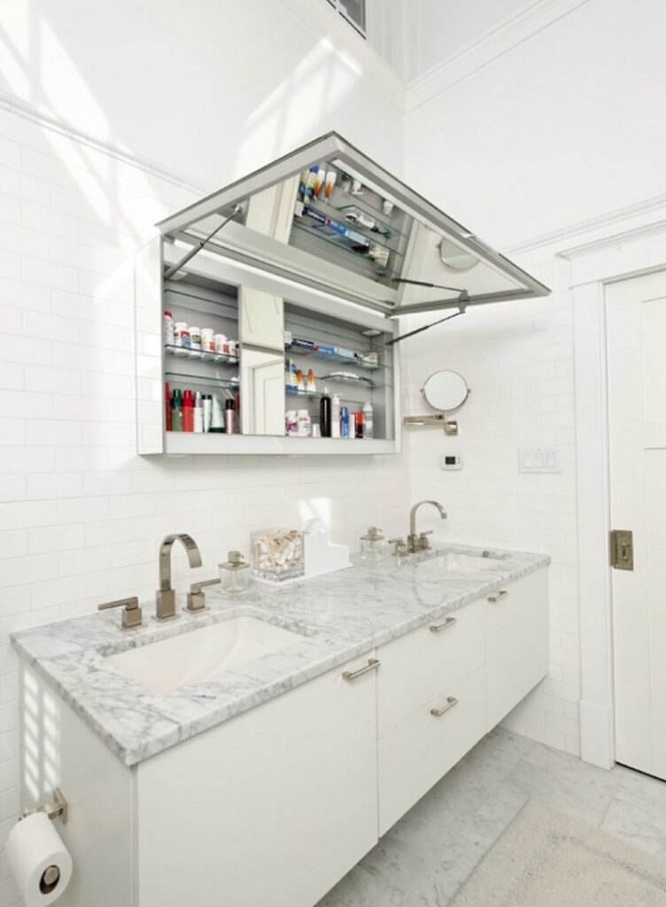 A bathroom featuring a long medicine cabinet