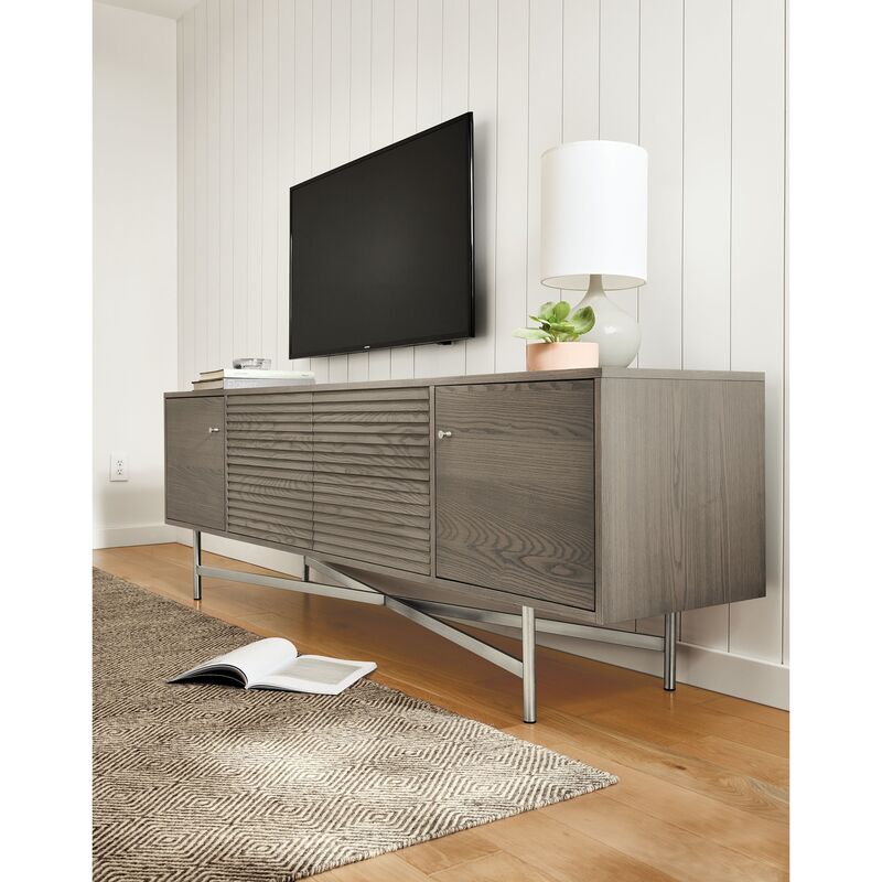 An 18-inch deep media cabinet showcasing hidden cable management and ample storage in a stylish home office