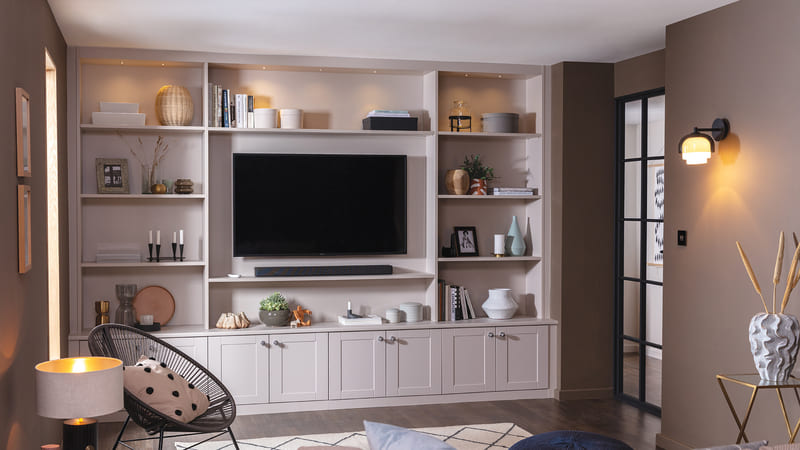 A full-wall media cabinet in a modern living room for a sophisticated design