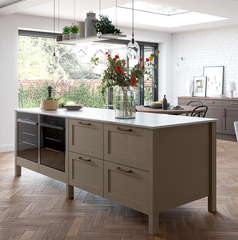 A freestanding open kitchen island with visible shelving and bar seating, ideal for modern, flexible layouts.