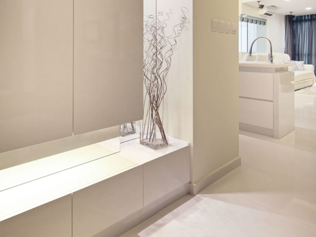 A tall shoe cabinet serving as a centerpiece in a luxury walk-in closet