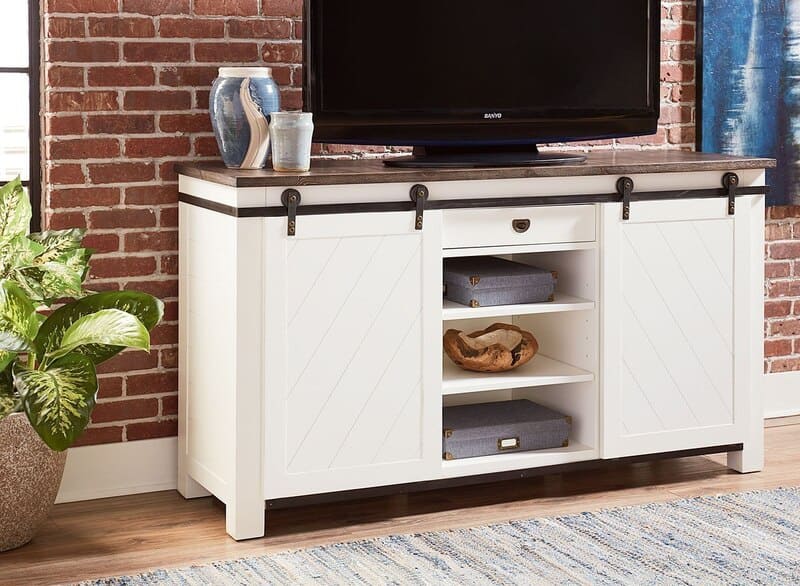 A modern sliding door media cabinet in a living room, showcasing sleek design and efficient storage