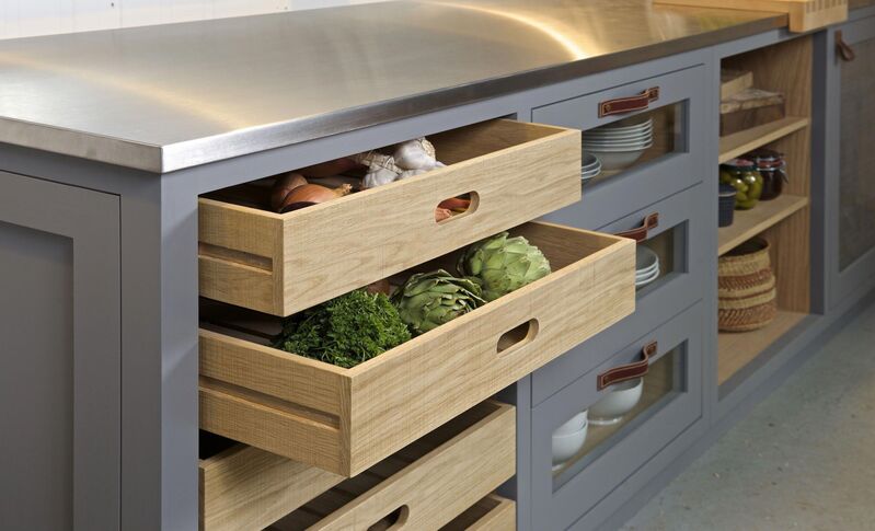 A contemporary kitchen featuring 4 drawer kitchen base cabinets with a sleek design