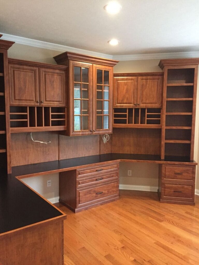 A sleek and modern kitchen showcasing custom storage cabinets, including a 3 drawer kitchen base cabinet