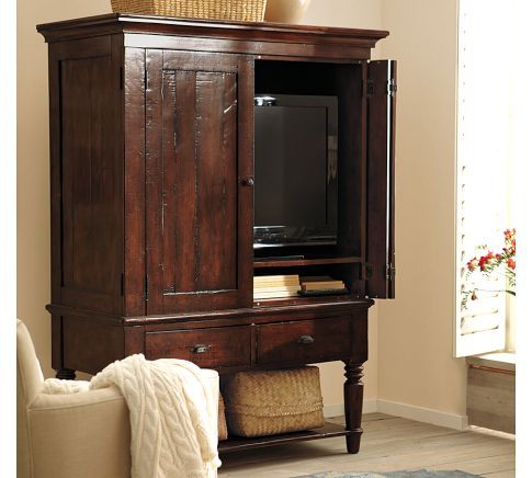 A tall media cabinet with customizable design