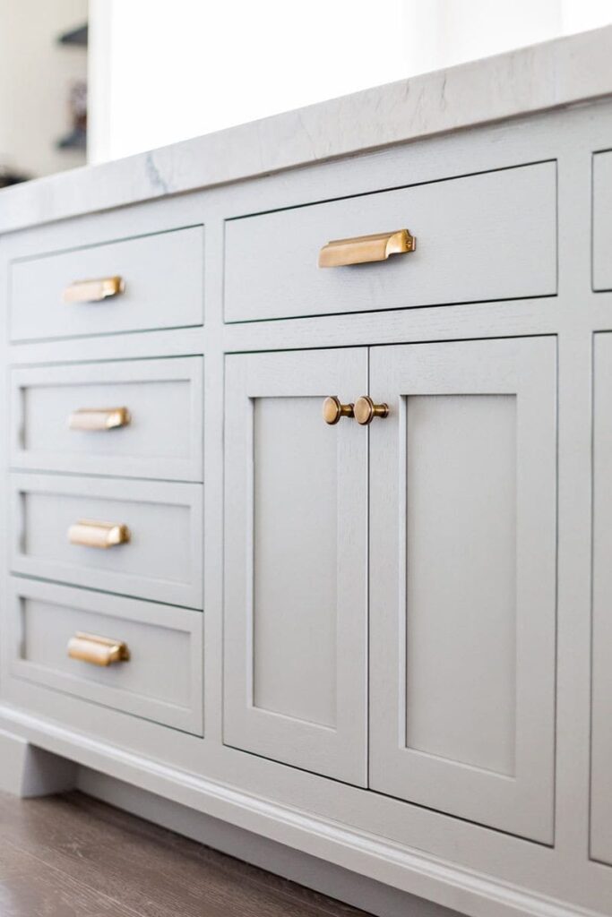 Traditional cabinet doors with brass handles in a luxurious kitchen setting