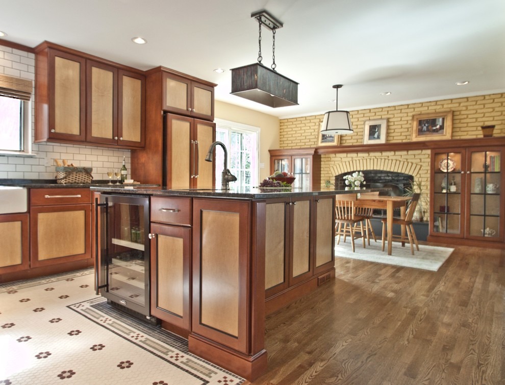 A two-tone wood finish kitchen cabinet design