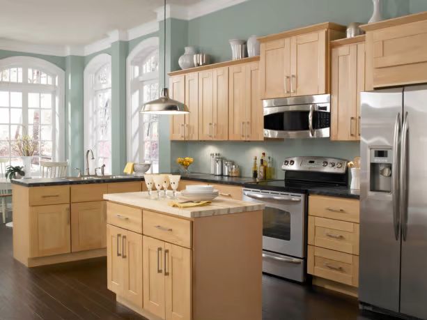 Smooth maple wood cabinets, offering a sleek and minimalist appearance for modern kitchens