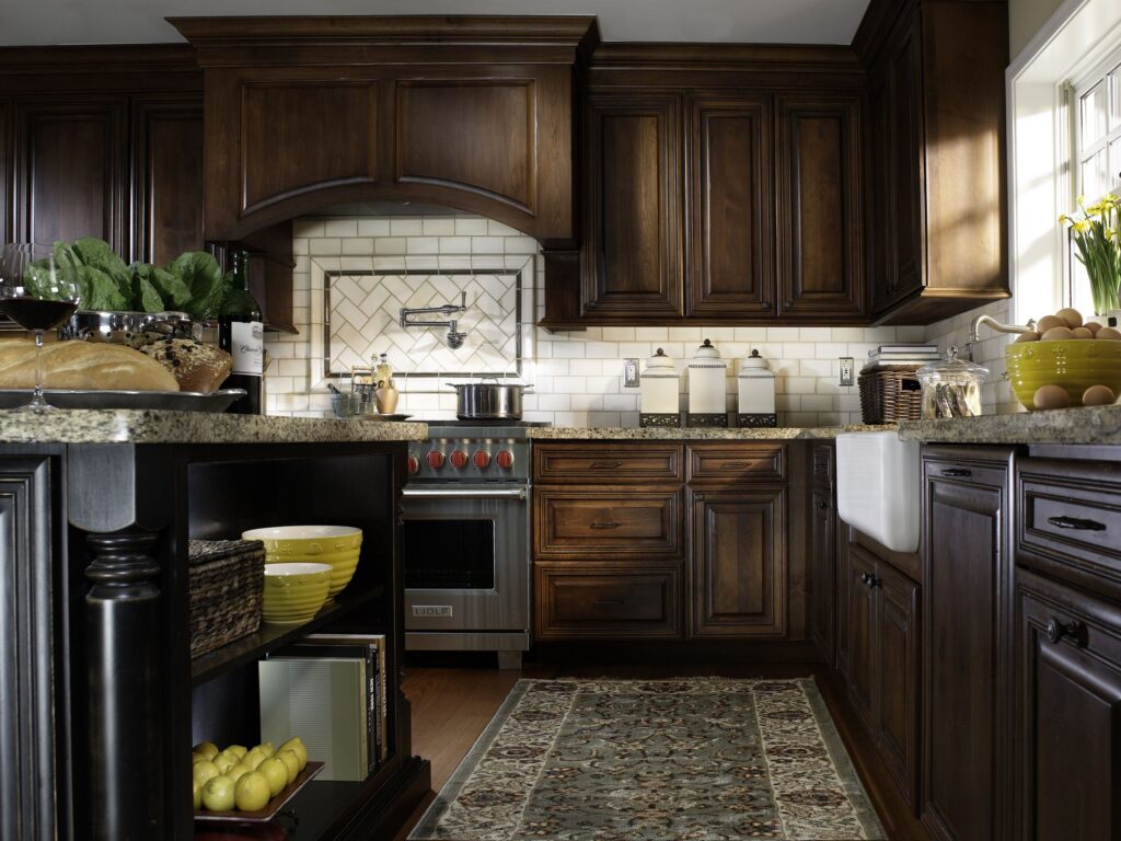 Cherry wood finish kitchen cabinets with a clear finish, showcasing rich and natural reddish tones in a luxury kitchen