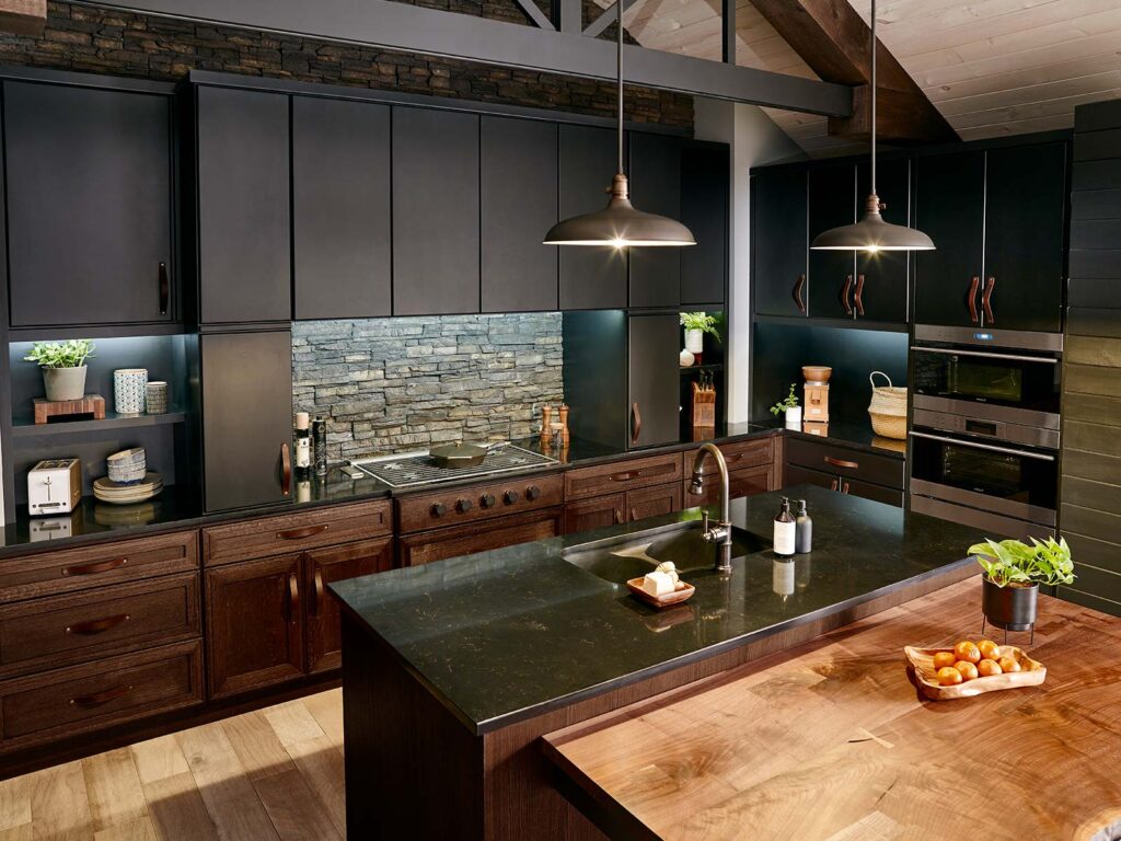 Mixed material kitchen cabinets featuring dark wood finishes with stone countertops and metal hardware, creating a modern and sophisticated look