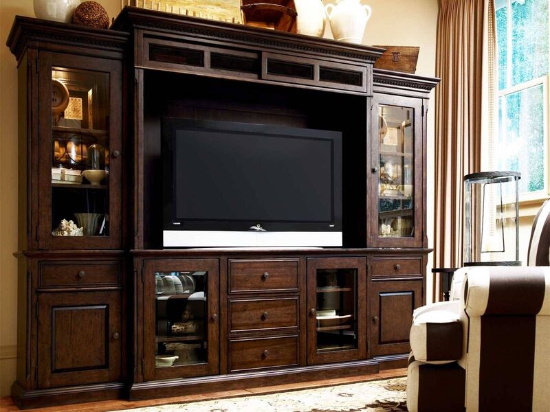 A custom-designed wood media cabinet with adjustable shelves for a contractor project