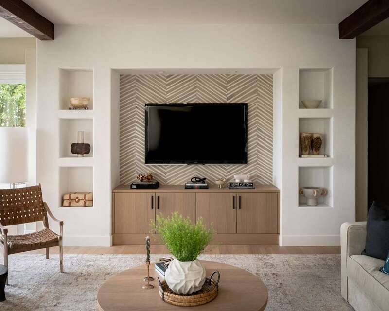 A light wood media cabinet in a modern living room, offering stylish and practical storage