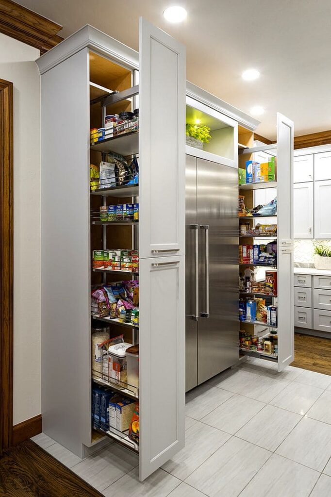 Modern pantry cabinet with pull-out drawers, integrated lighting, and adjustable shelves for maximum functionality