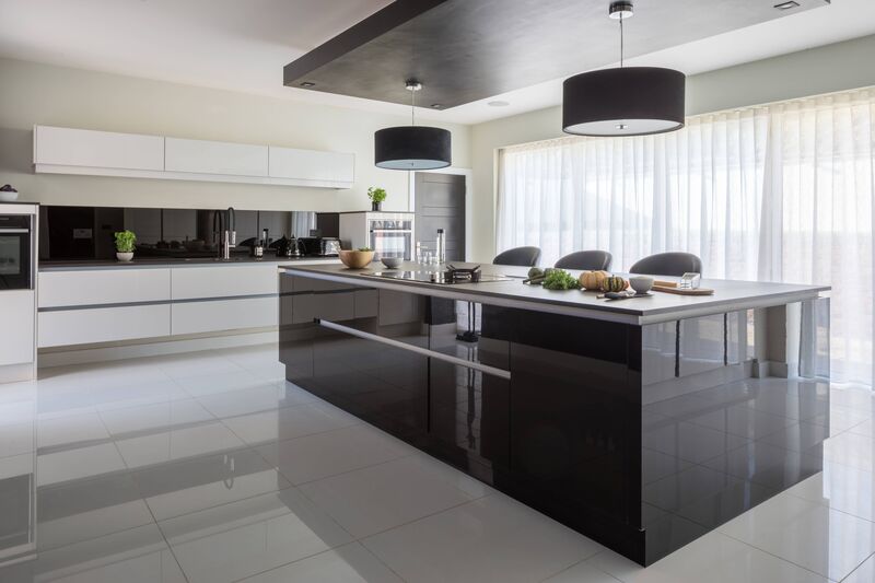 A sleek kitchen showcasing a well-organized cabinet layout and a centrally positioned island for optimal use