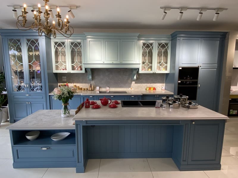 A modern kitchen showcasing a well-spaced island and cabinets for optimal flow and functionality