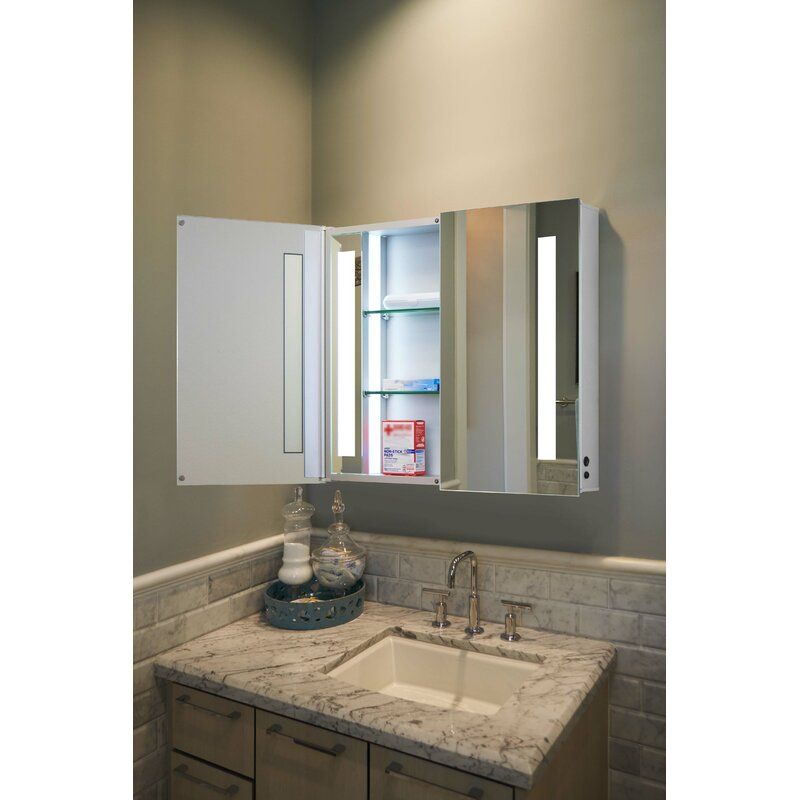 A frameless bathroom medicine cabinet with a recessed installation and mirrored front, ideal for compact spaces